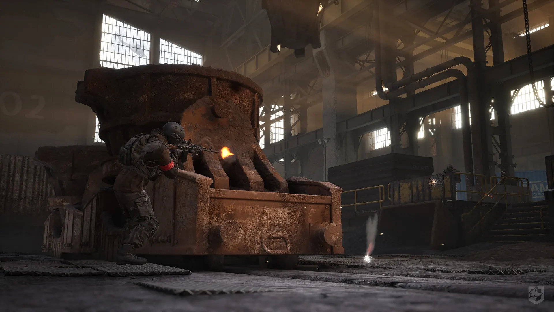 Operators moving through a dim WARDOGS foundry