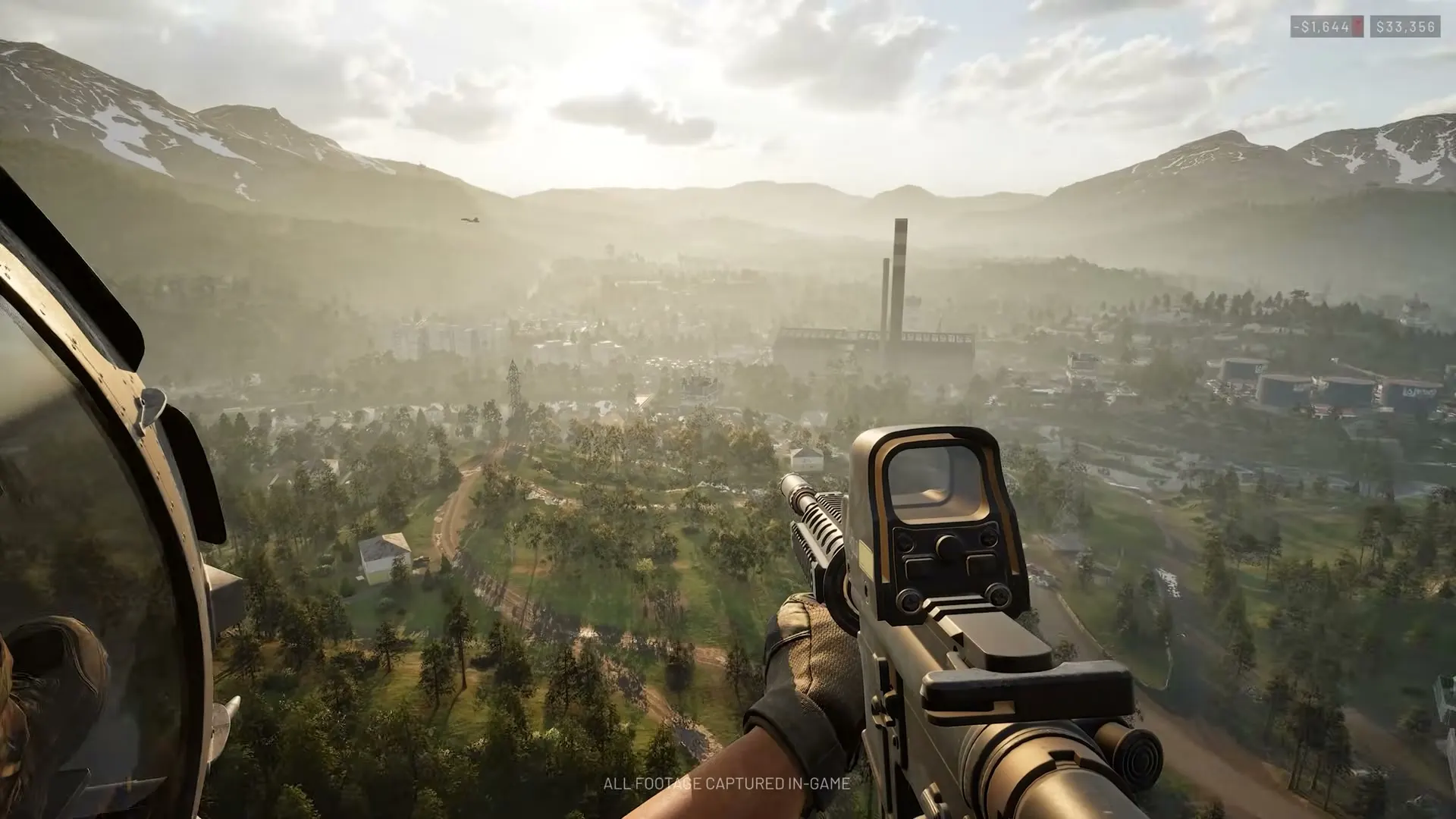 A first-person WARDOGS view over a broad industrial valley