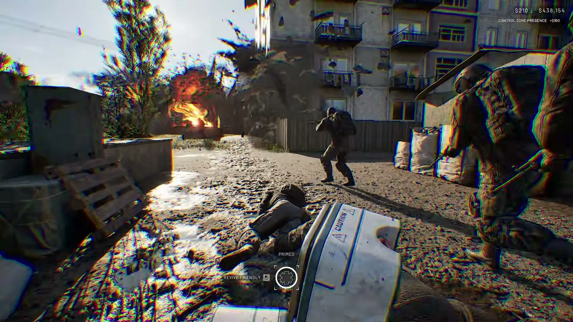 A WARDOGS player assisting a downed teammate during a firefight