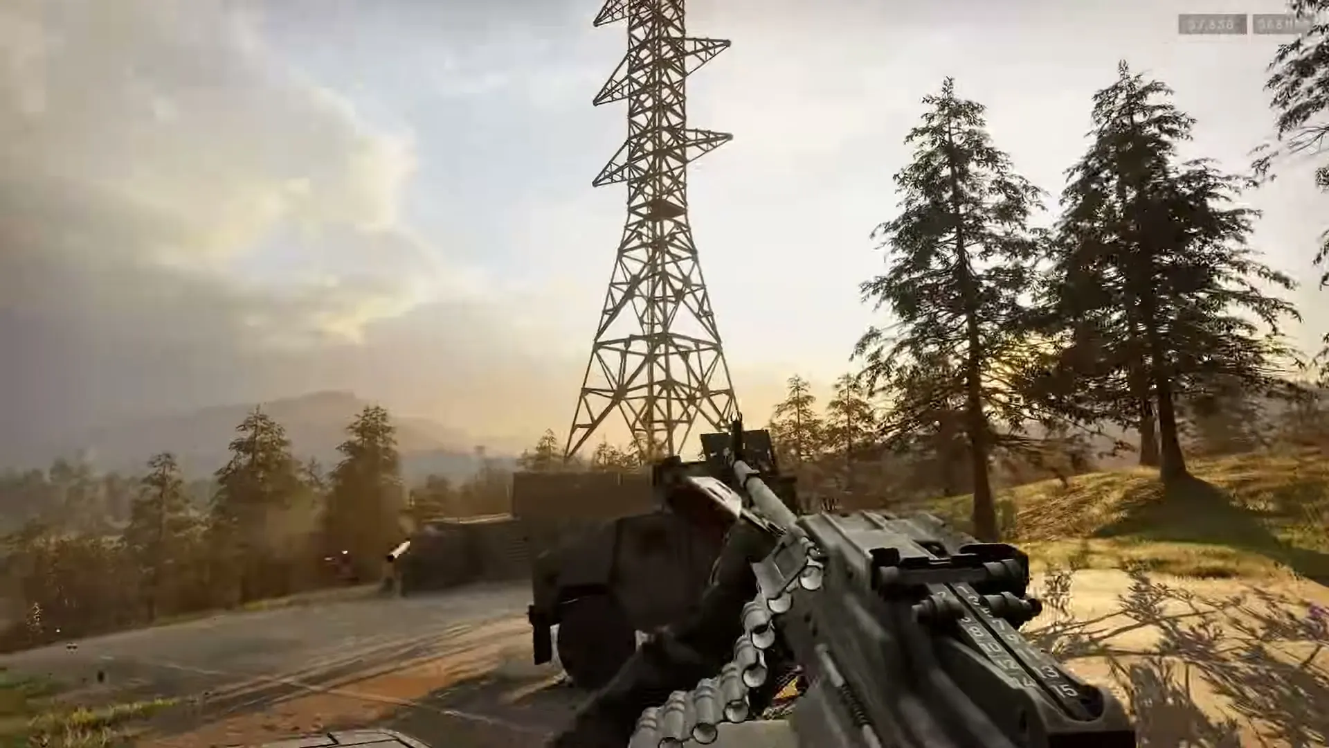 A WARDOGS operator watching a forested ridge at sunset