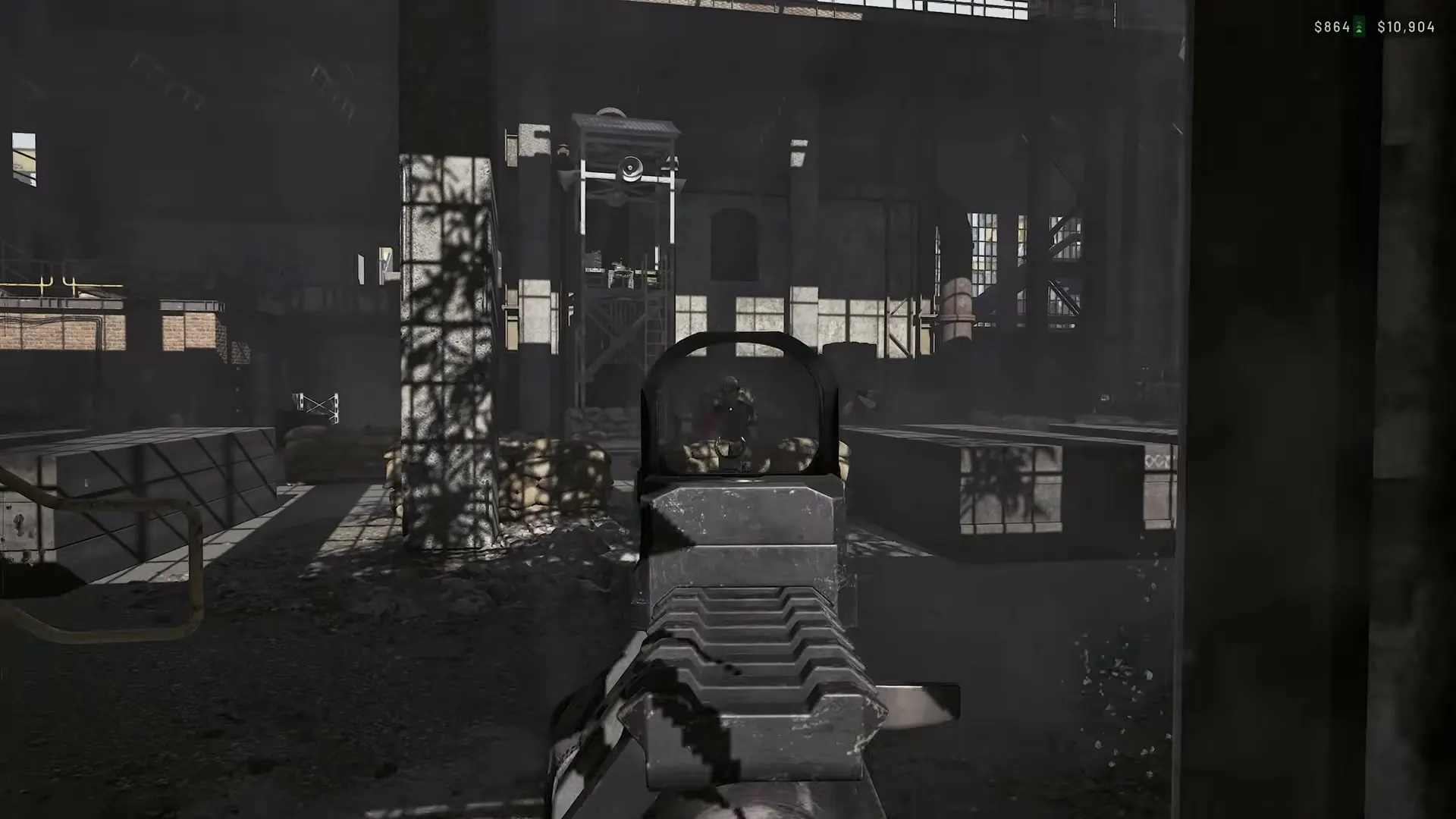 A WARDOGS rifle sight inside a dark industrial hall