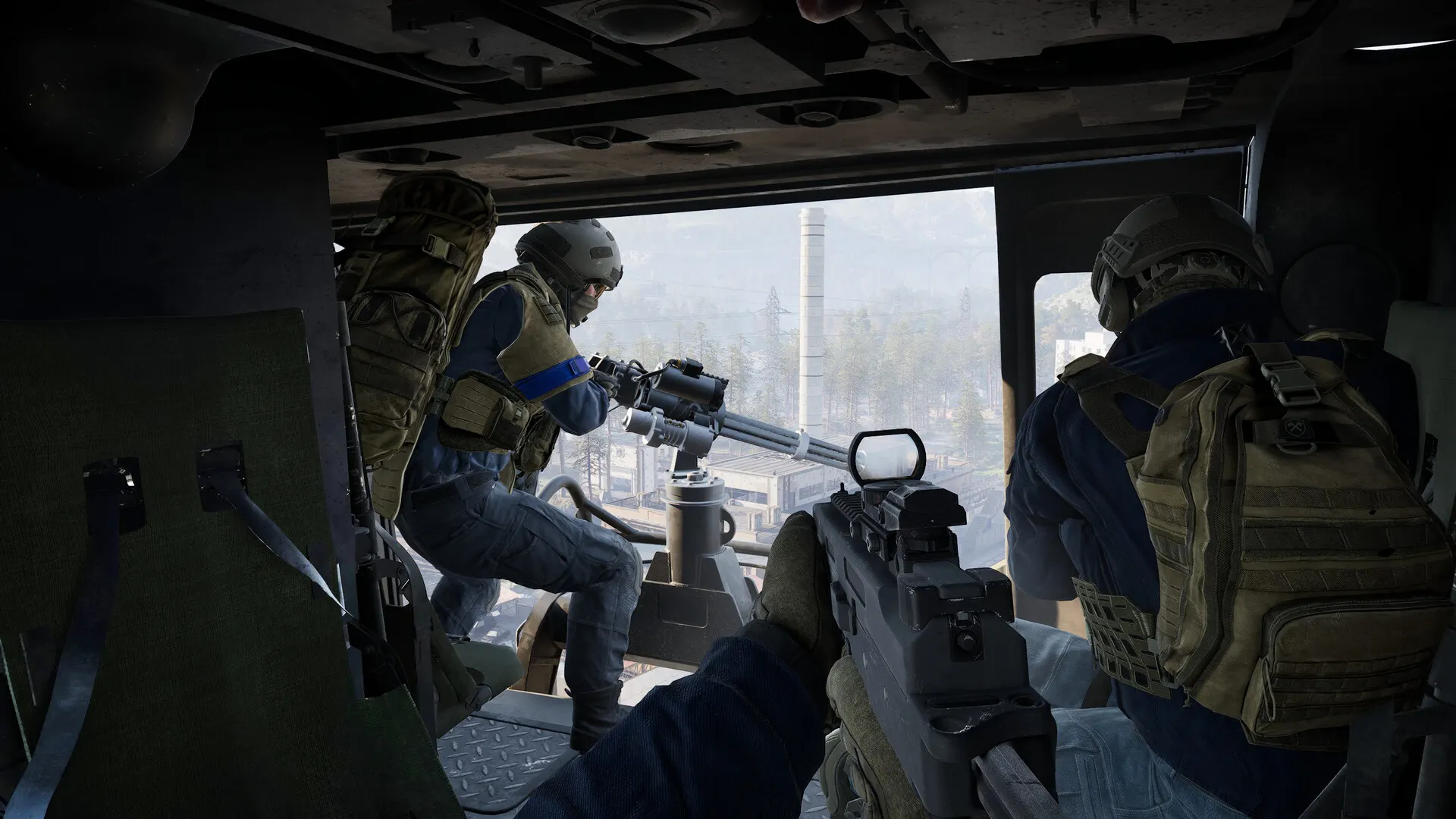 Operators riding inside a WARDOGS transport helicopter