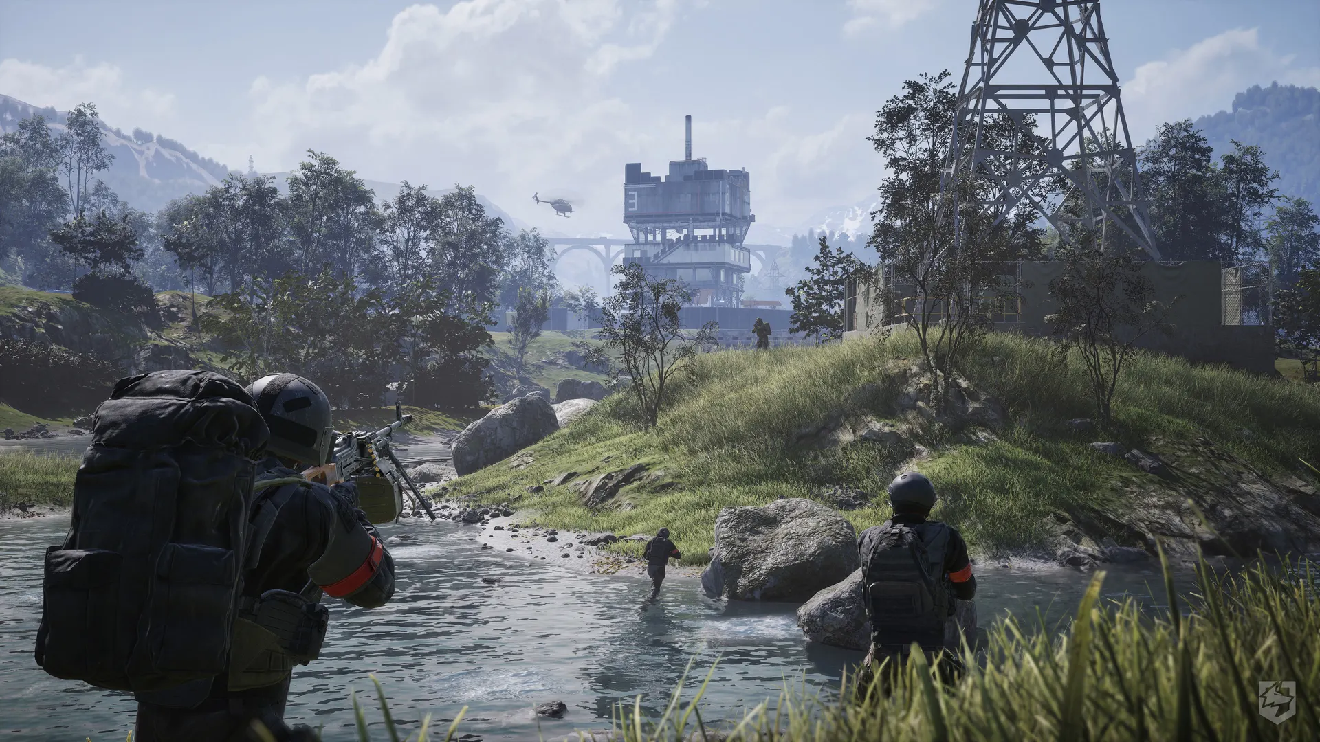A WARDOGS squad crossing a shallow river toward an industrial tower