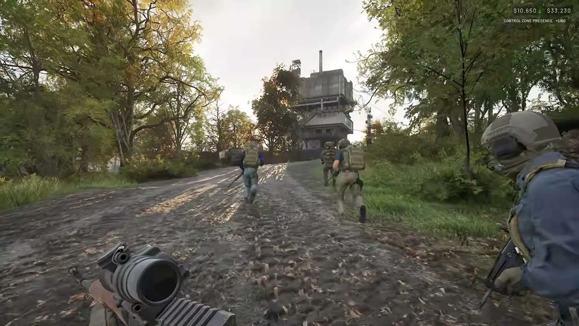 A WARDOGS squad advancing together along a wooded road